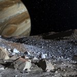 The rocky surface of Europa with Jupiter in the background.