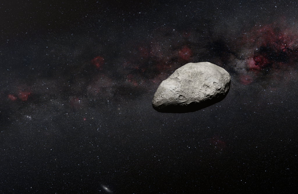 Illustration of an irregularly-shaped grey asteroid against the dark background of space.