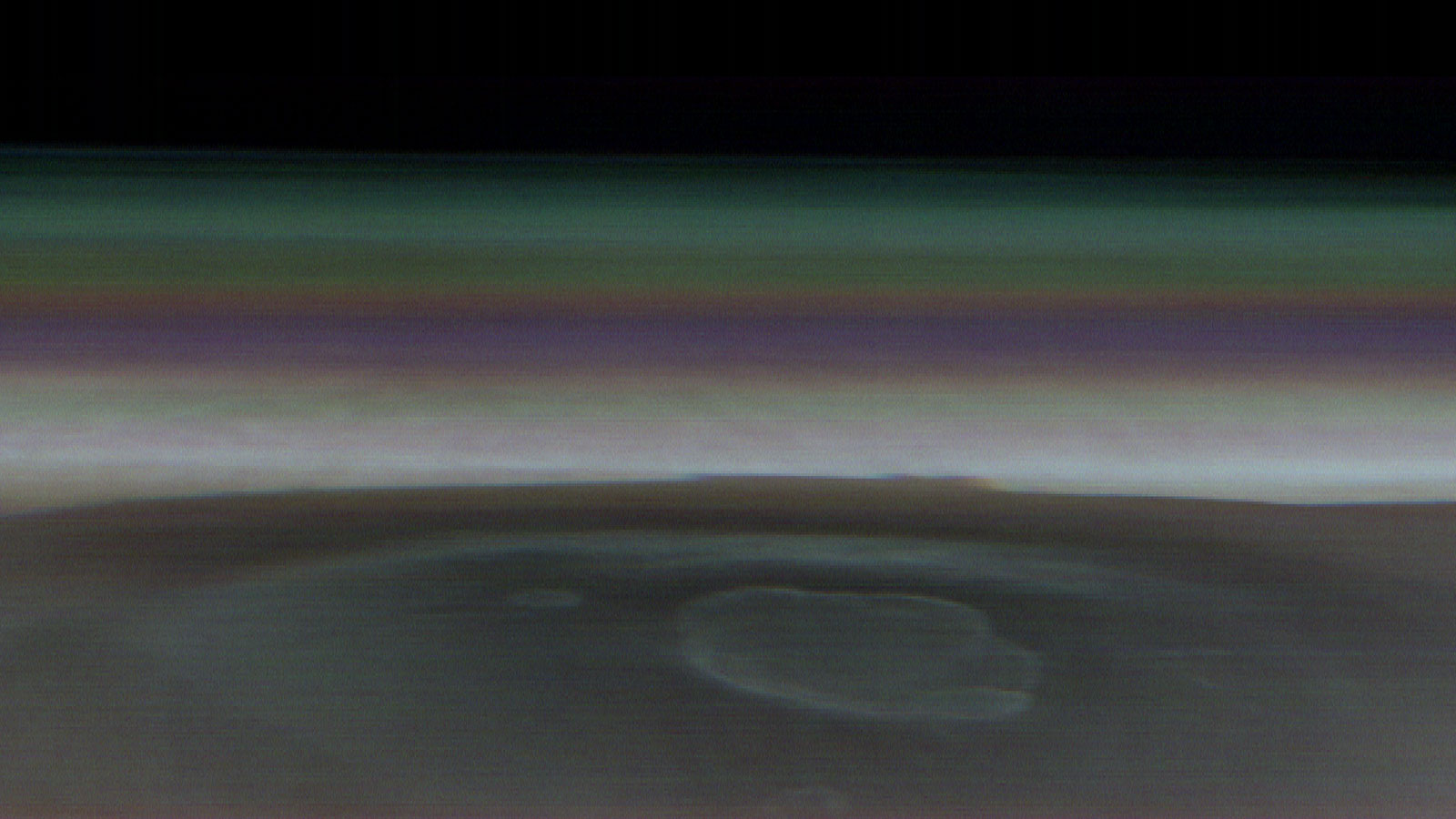 NASA’s 2001 Mars Odyssey orbiter captured this single image of Olympus Mons, the tallest volcano in the solar system, on March 11, 2024. Besides providing an unprecedented view of the volcano, the image helps scientists study different layers of material in the atmosphere, including clouds and dust.