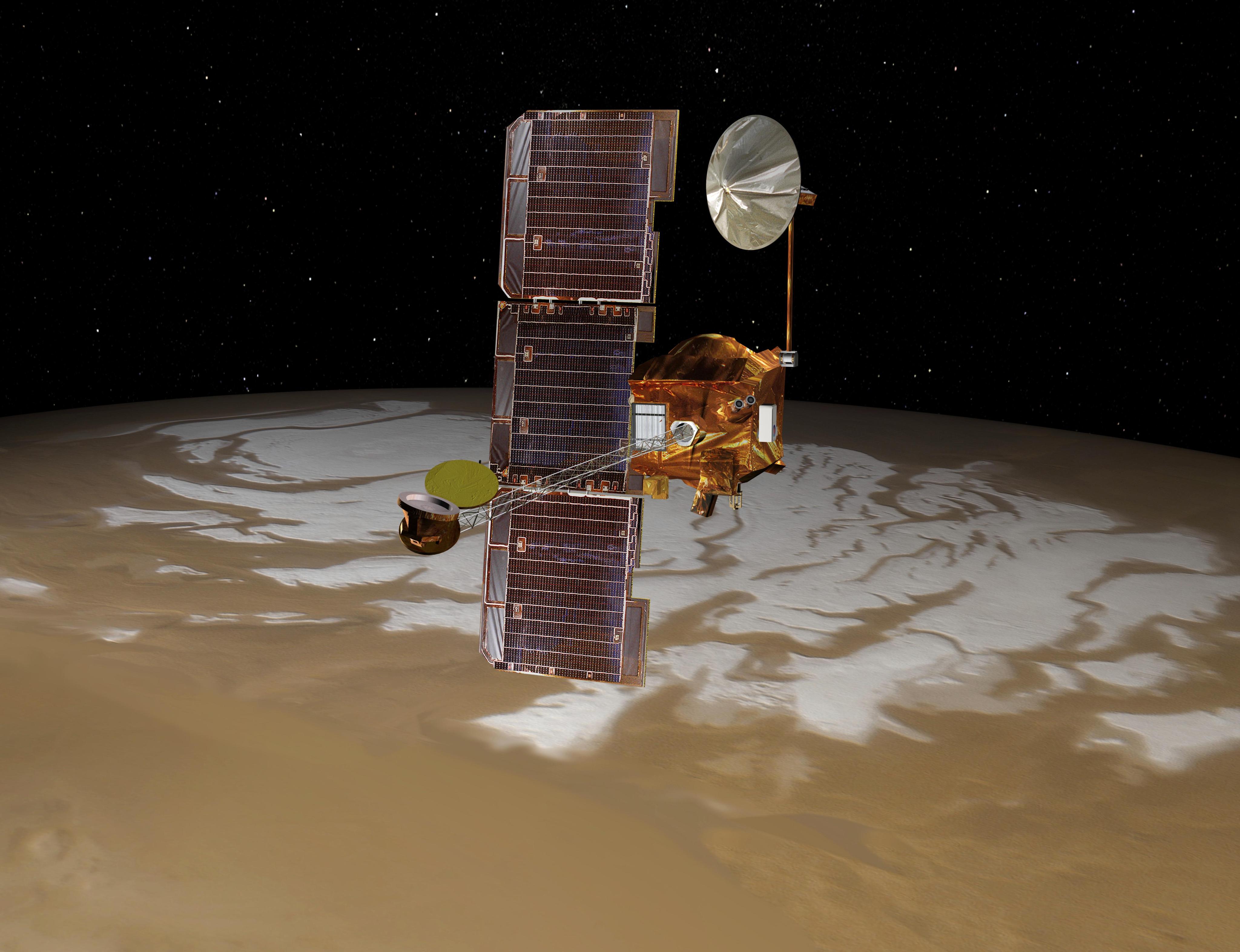 A gold-colored spacecraft orbits over Mars, with a dish antenna extending from its top, a spindly boom extending from the front of it toward the viewer, and a large three-paneled solar array attached vertically to its left side. Mars appears as a dusty tan color covering the lower half of the frame, with patches of white at its top, against a black sky flecked with stars in the upper frame.