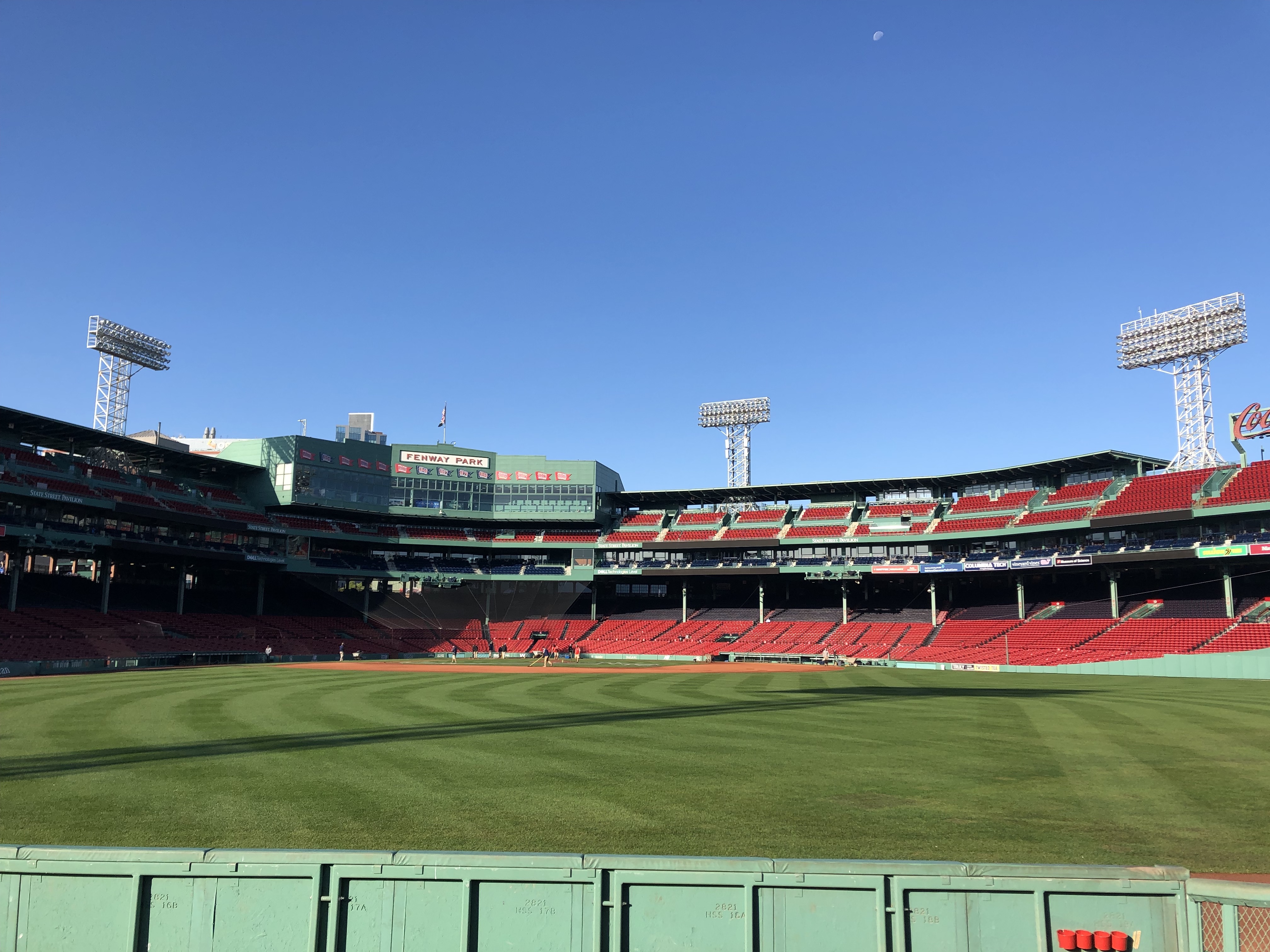 The Moon is visible over Fenway Park's baseball field in this cell phone image.