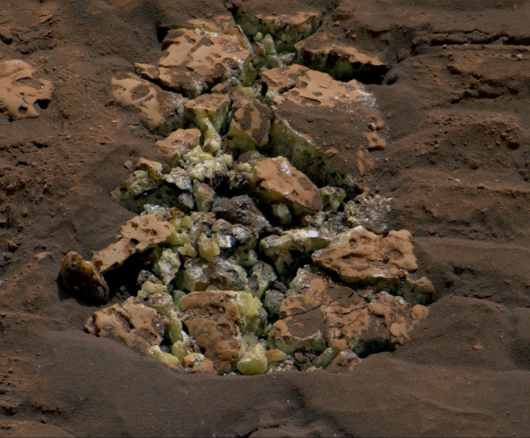 These yellow crystals were revealed after NASA’s Curiosity happened to drive over a rock and crack it open on May 30. Using an instrument on the rover’s arm, scientists later determined these crystals are elemental sulfur — and it’s the first time this kind of sulfur has been found on the Red Planet.