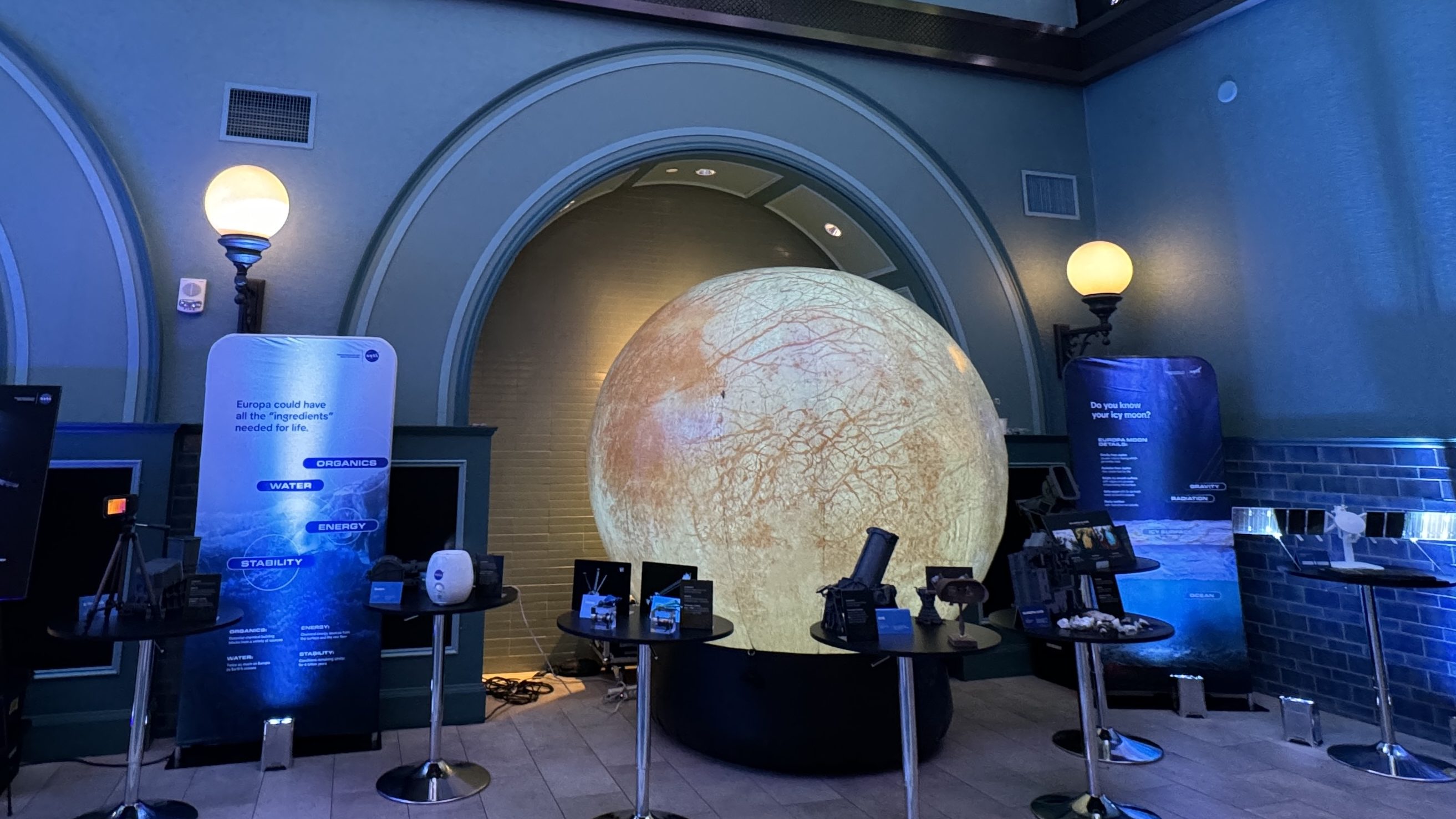 Europa Clipper Roadshow is set up in a room at the St. Louis Aquarium.