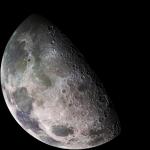 A beautiful image of the Moon taken by the Galileo spacecraft on December 7, 1992. It shows a partially lit Moon with mild red and green color.