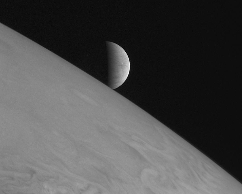 Europa rises above Jupiter in this image from New Horizons,