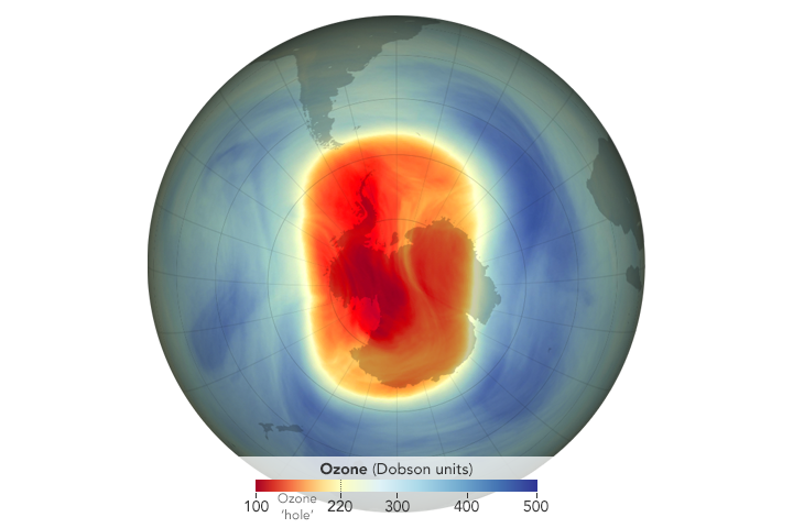 Visualization of Earth as seen from the south pole over Antarctica. Data is overlayed, showing the level of ozone in the area. Centered over Antarctica is a red and orange oval, while the rest of the visualization shows dark and light blues.