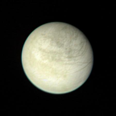 Europa appears pearl-colored in this image from Voyager 1.