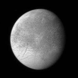 Europa appears gray with darker streaks in this image from New Horizons.