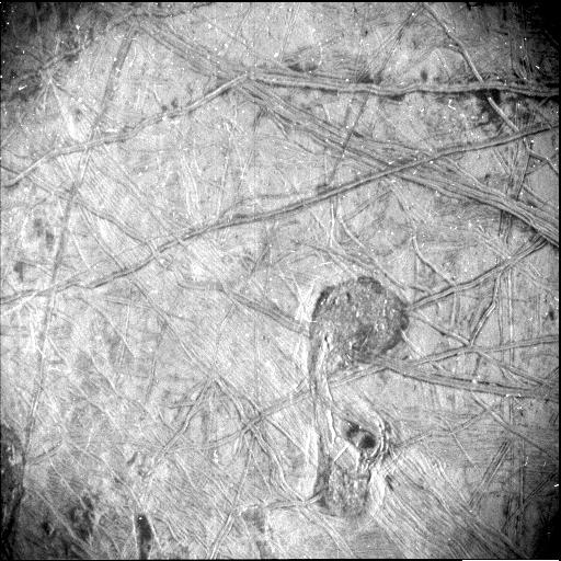 A black and white image of Europa's surface shows a feature shaped somewhat like the musical symbol for a quarter note – surrounded by linear ridges and dark blotches.