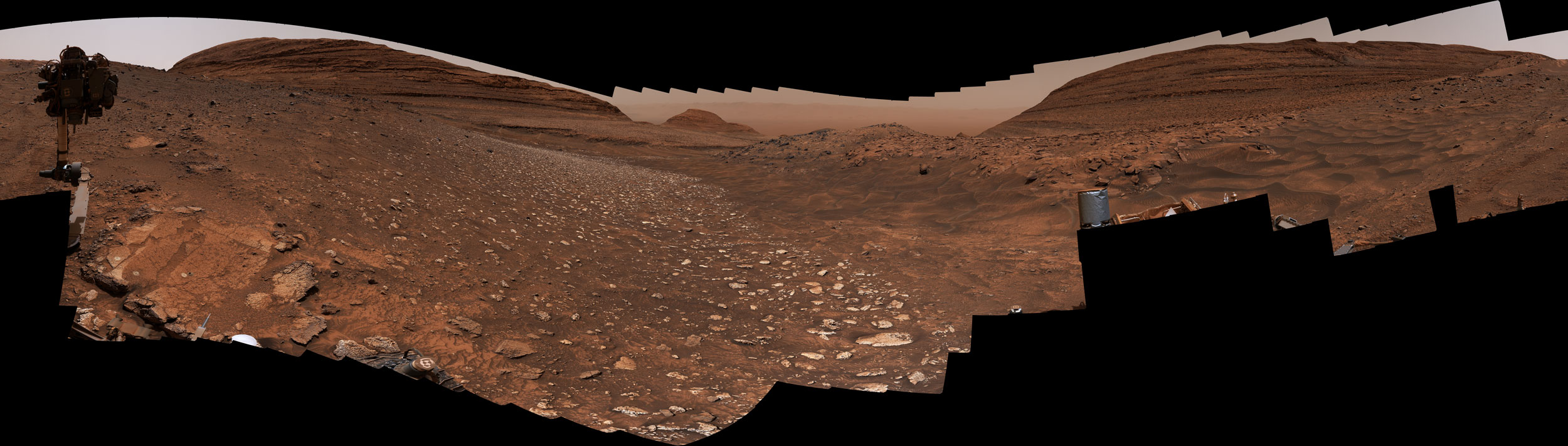 NASA’s Curiosity Mars rover used its Mast Camera, or Mastcam, to take this 360-degree panorama from within Gediz Vallis channel on June 19, 2024, the 4,220th Martian day, or sol, of the mission. The panorama is made up of 336 individual images that were stitched together after being sent back to Earth. The color has been adjusted to match lighting conditions as the human eye would see them on Earth.