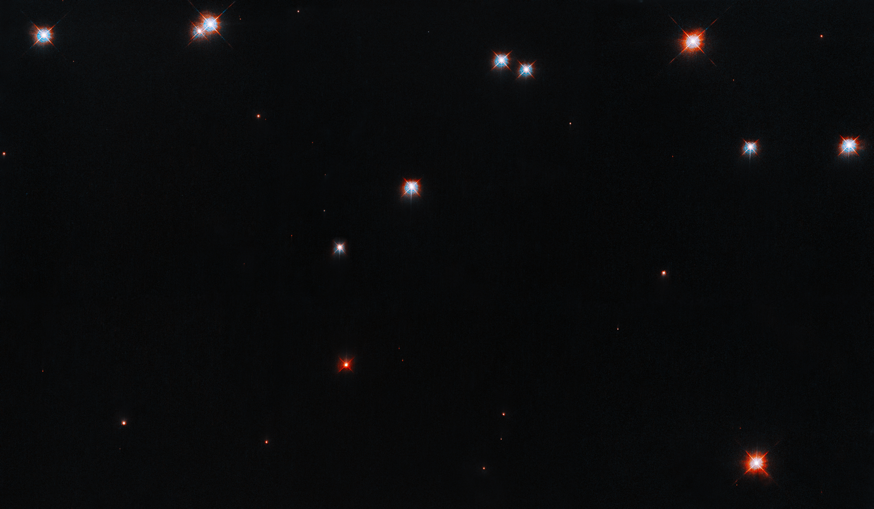 A smattering of stars against a black background.