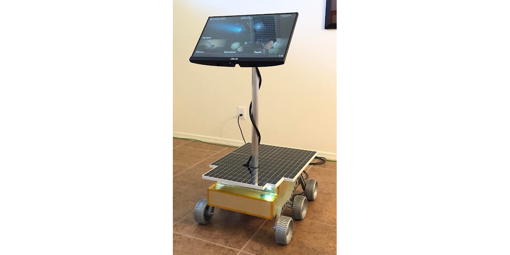 A touchscreen NASA Eyes Kiosk mounted on a scale model of the Sojourner Mars rover at the Patterson Observatory.