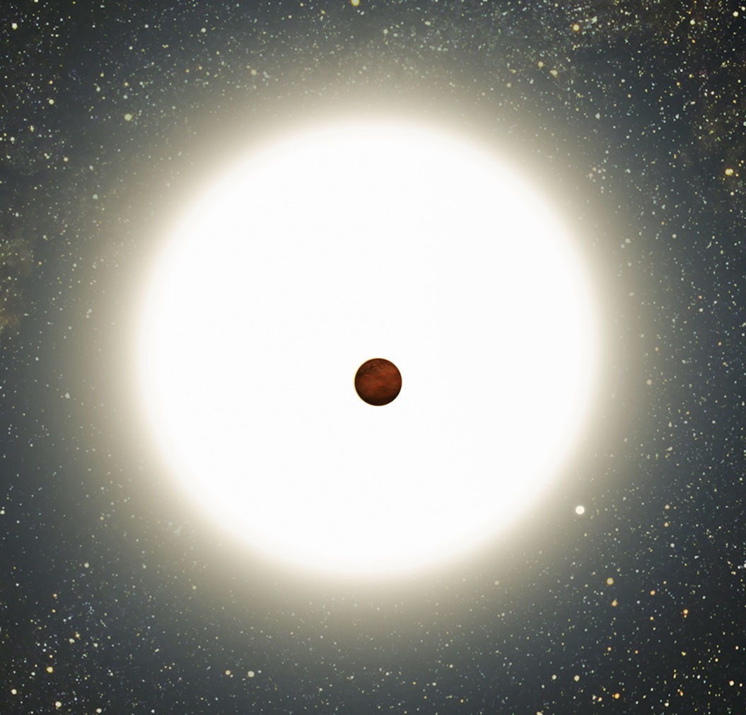 The image depicts a celestial scene, with a bright, luminous star dominating the background. In the center of the image, a small, dark, rocky planet is seen transiting in front of the star, creating a stark contrast between the bright light of the star and the silhouette of the planet. Surrounding the star and planet, the background is filled with countless tiny stars scattered across the vast expanse of space. The star appears to radiate a soft glow, with a bright halo of light around it, emphasizing the planet's position as it passes in front of the star. The overall scene evokes a sense of the vastness and beauty of the cosmos.