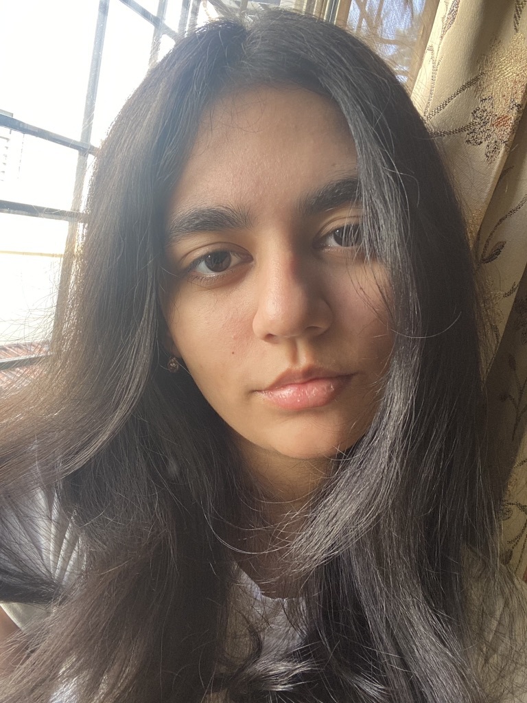 Portrait photo of a young woman with long dark hair