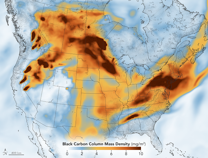 A map of the United States and southern Canada with blue, orange, and red shading. The orange and red areas have higher levels of black carbon in the air, which is coming from wildfires. The major areas of black carbon are in the Northeastern U.S., the upper Great Plains, south-central Canada, and across the northern Rockies. 