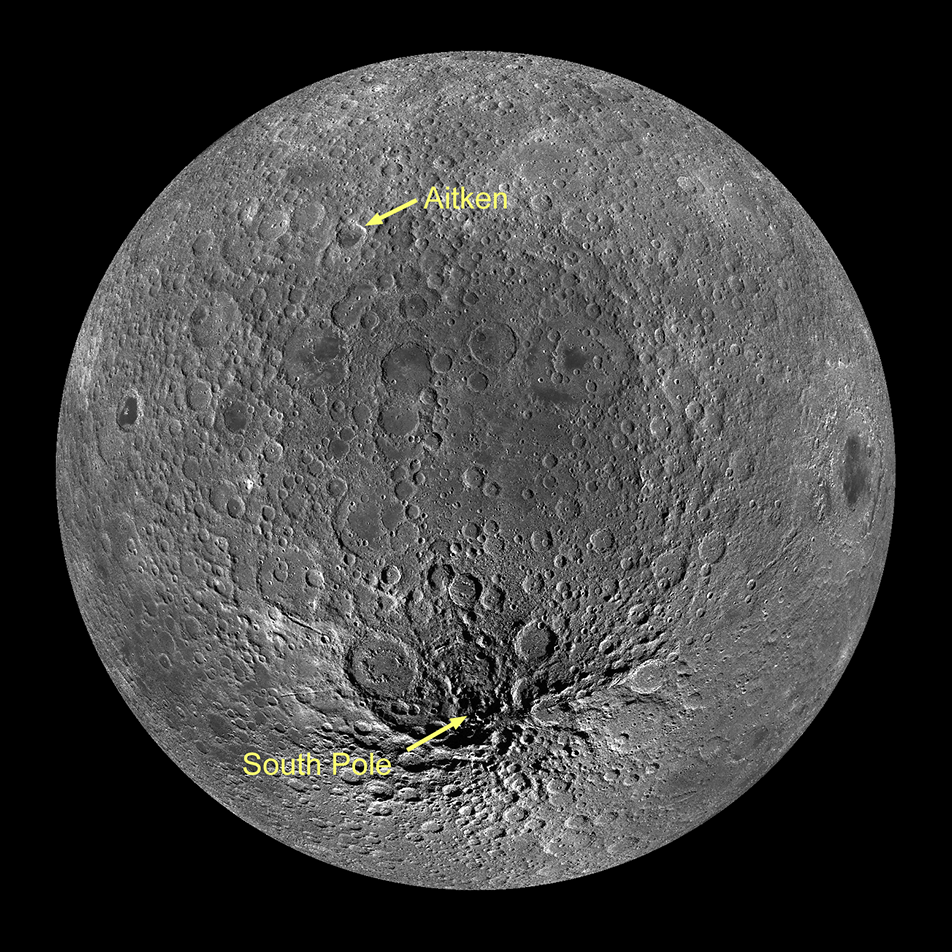 This image captures the entire far side of the Moon, which is covered liberally with craters, in order to capture the South Pole Aitken-Basin, which covers a large portion of this side of the Moon. The basin is indicated by two called-out points in yellow text with arrows, the Aitken crater, near the top of the Moon and the South Pole, near the bottom. The space in between is Aitken Basin. It appears slightly darker than its surroundings.