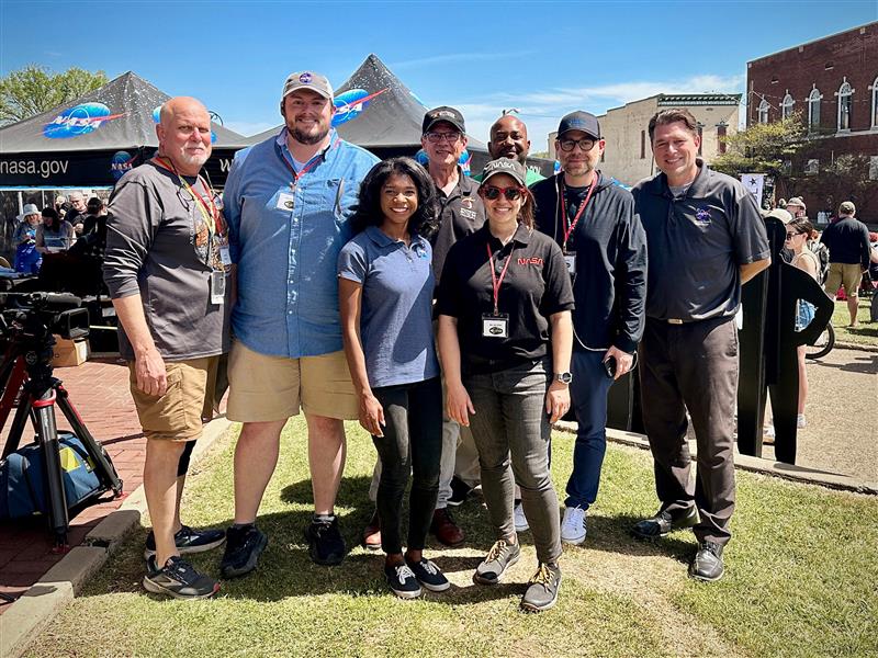 Broadcast team members in Russellville, Arkansas pose for a picture at their location near the Downtown Russellville Block Party.