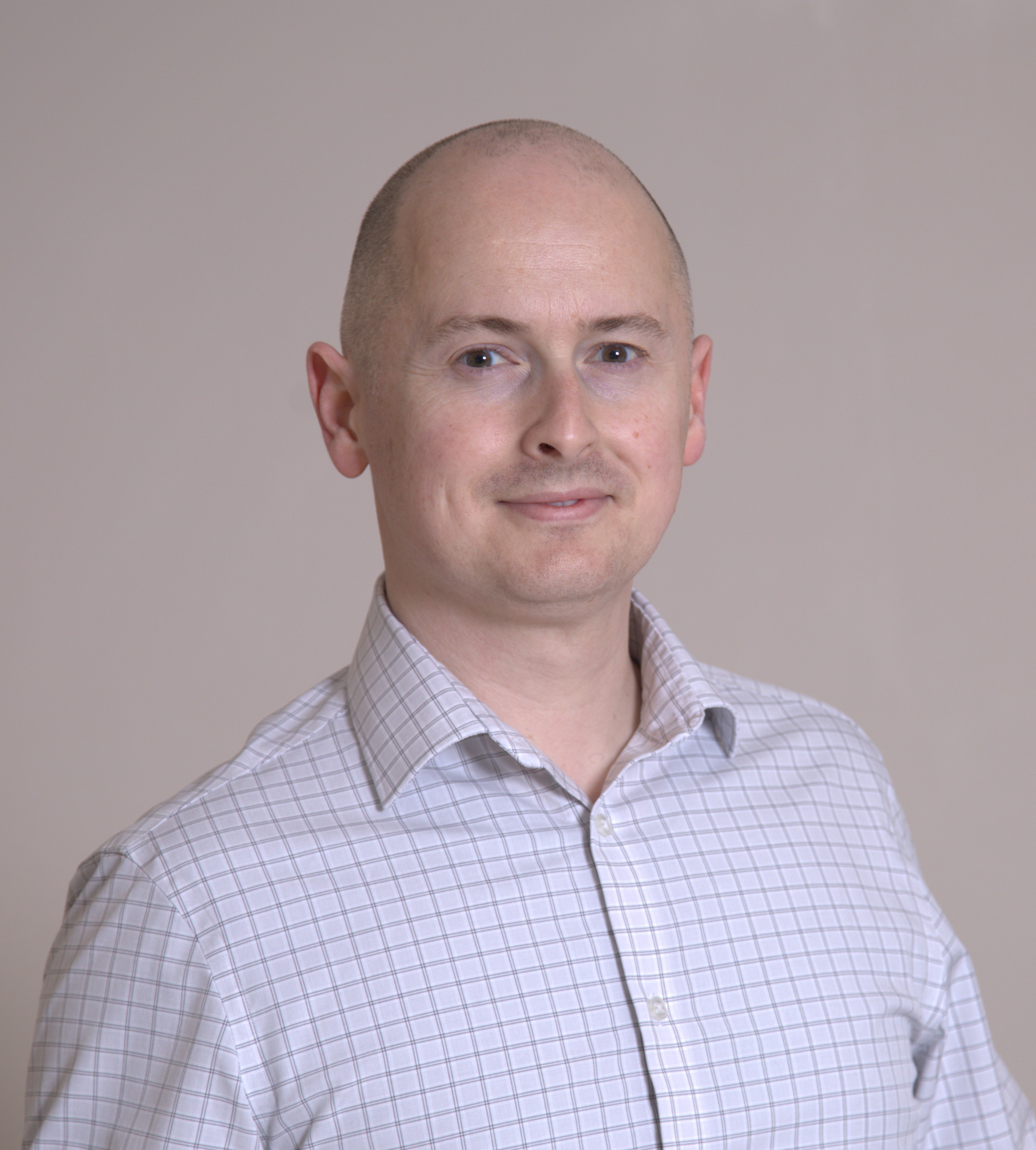 A portrait photo of NASA scientist Andrew Needham.