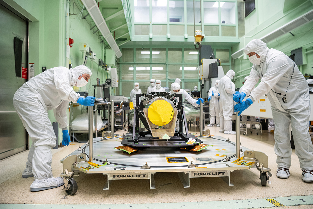 Clean room technicians move a prototype LISA telescope.