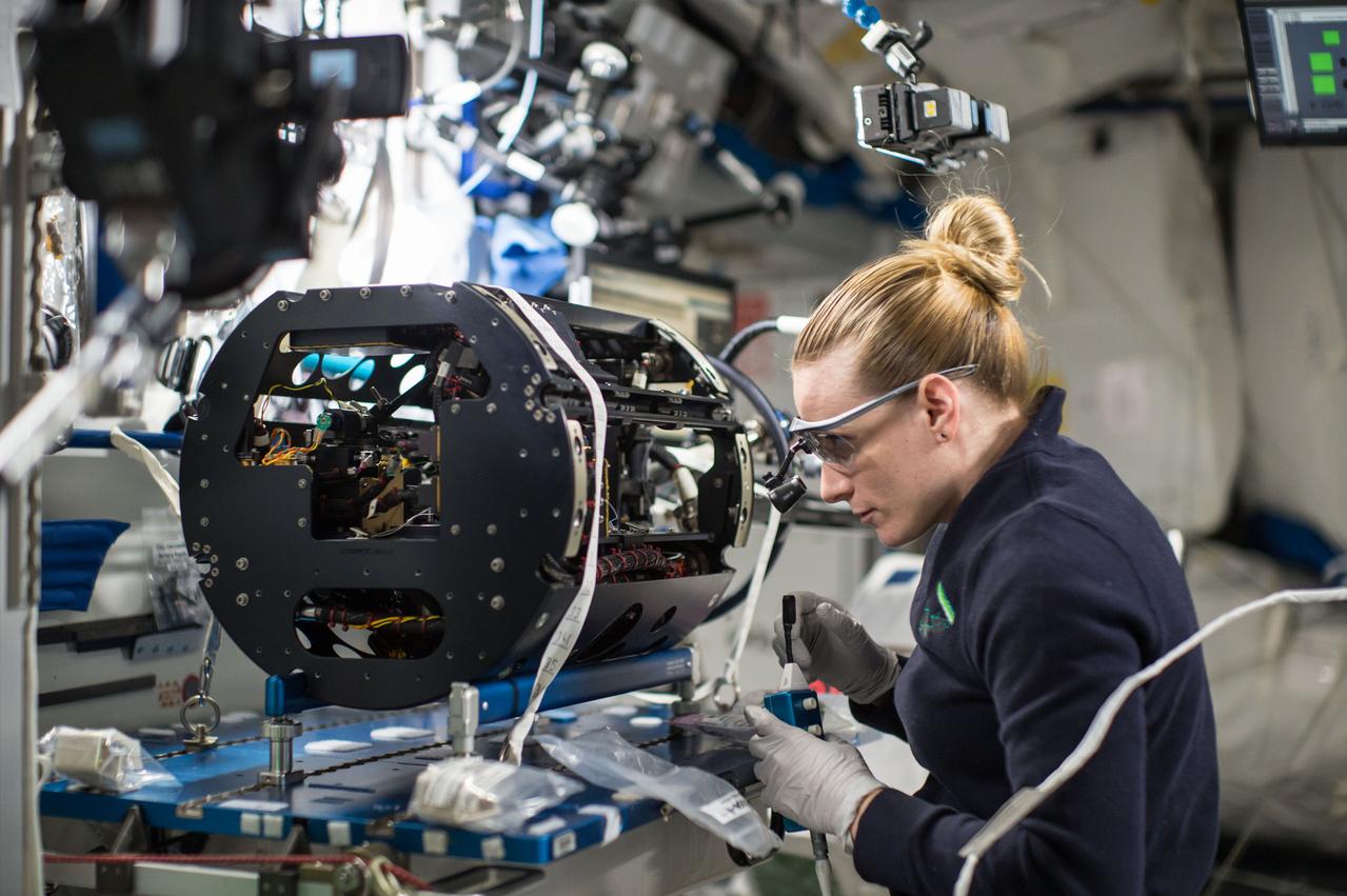 NASA astronaut Kate Rubins is photographed replacing two Multi-user Droplet Combustion Apparatus (MDCA) Igniter Tips as part of the Combustion Integration Rack (CIR) Igniter Replacement operations. The CIR is used to perform combustion experiments in microgravity. The CIR can be reconfigured easily on orbit to accommodate a variety of combustion experiments. It consists of an optics bench, a combustion chamber, a fuel and oxidizer management system, environmental management systems, and interfaces for science diagnostics and experiment specific equipment.