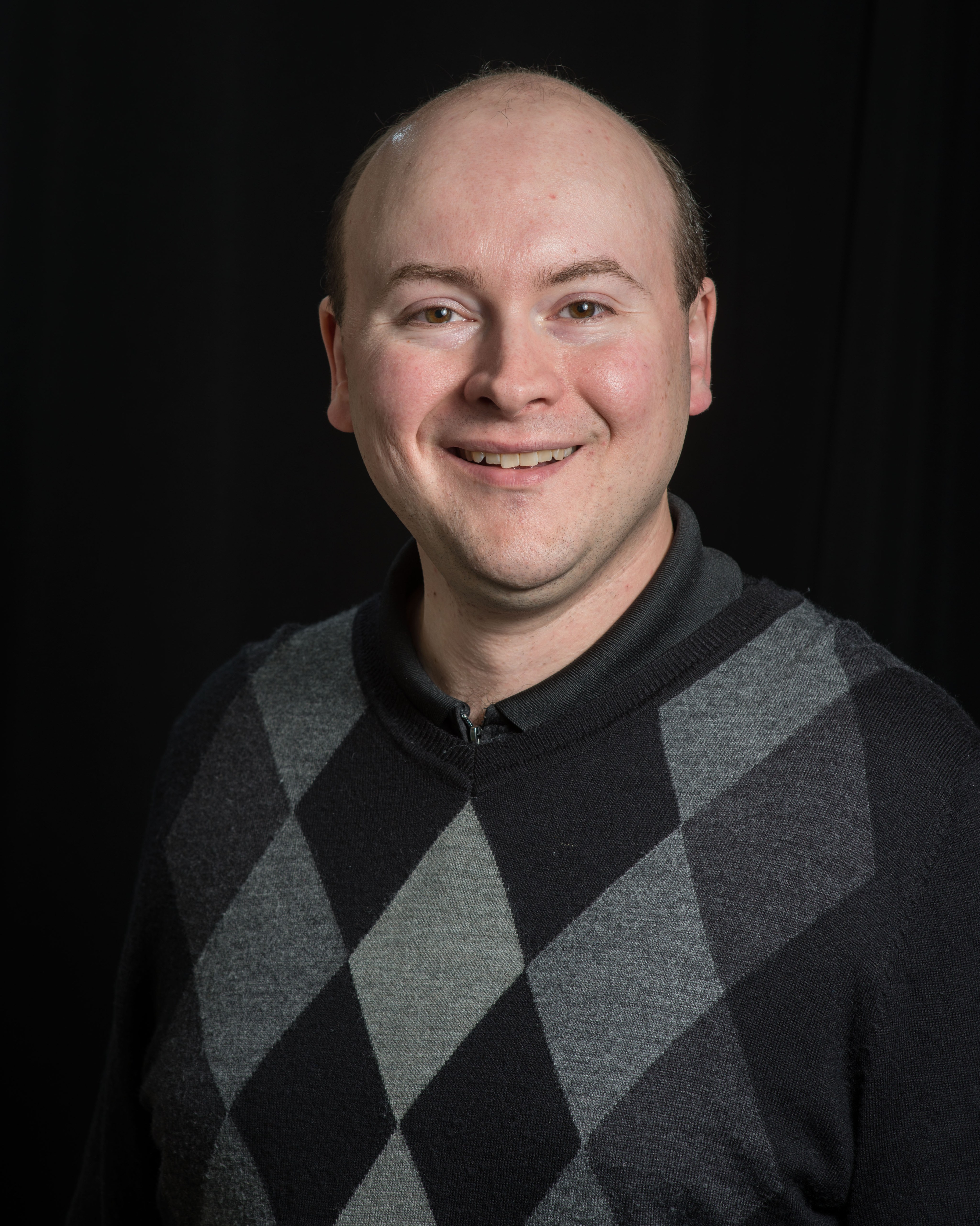 A portrait photo of NASA scientist Samuel Lawrence.