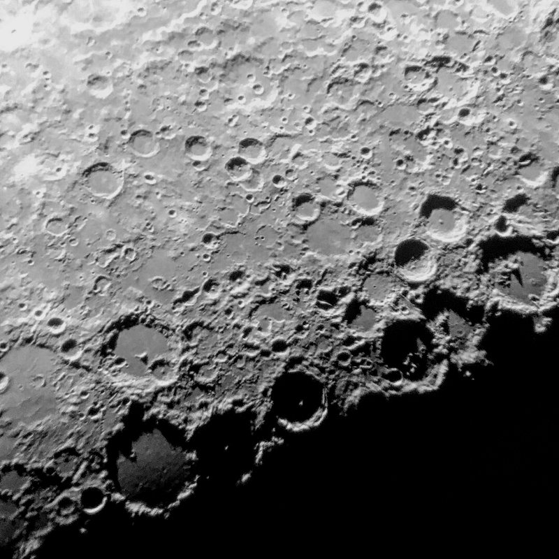 Photo of many rough craters on the Moon.