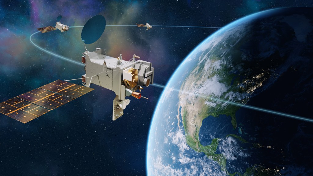 3 spacecraft are shown on an equally spaced on orbit path above the earth showing the north america visible below.