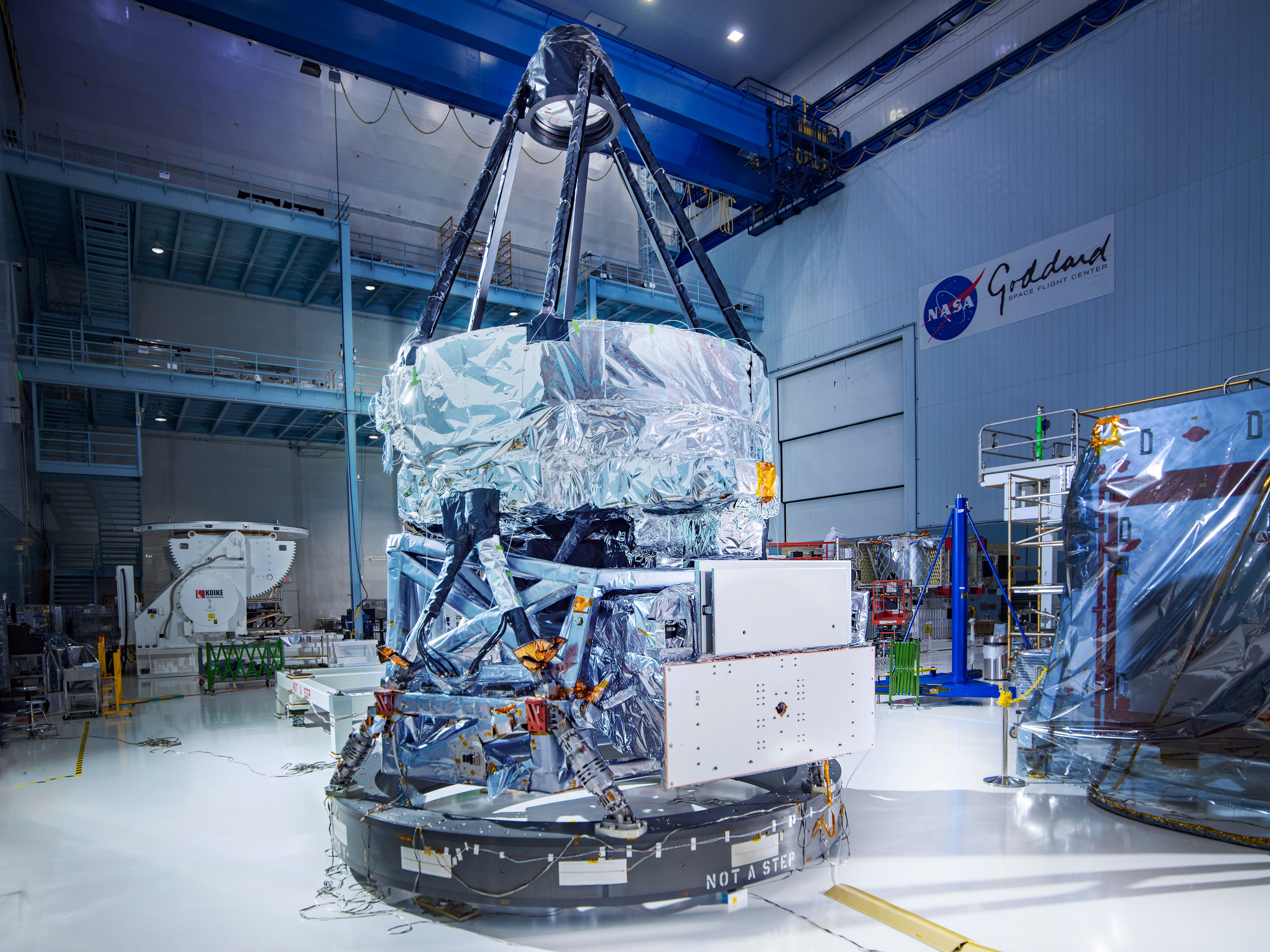 The Roman Optical Telescope Assembly (top) installed onto the Roman Instrument Carrier (bottom) in the Goddard clean room.