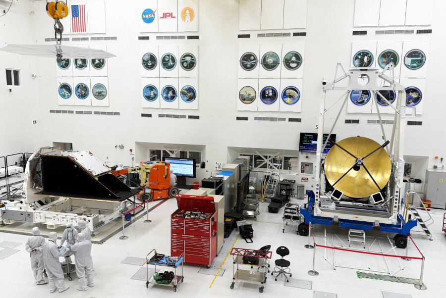 NASA JPL cleanroom with space hardware and technicians.